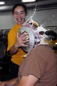US_Navy_110912-N-RC734-066_Ensign_Patricia_Cunanan_shoves_a_pie_in_the_face_of_Command_Master_Ch.jpg