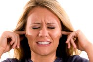 stock-photo-13834575-woman-with-fingers-in-her-ears.jpg