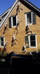 skeletons crawling up house.jpg