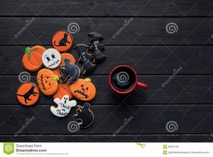 halloween-cookies-cup-coffee-pile-halloween-cookies-cup-coffee-black-table-99433109.jpg