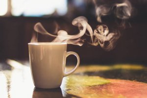 close-up-of-steaming-cup-of-coffee-or-tea-on-vintage-table-early-on-picture-id1137365972.jpg