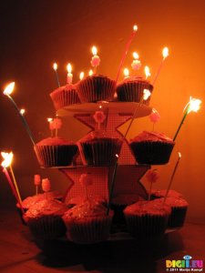 SX17138 Jen's cupcake birthday cakes with candles lit.jpg