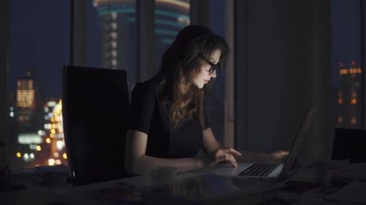 depositphotos_255735848-stock-video-young-business-woman-working-late.jpg