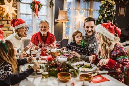 happy-extended-family-having-new-years-lunch-at-royalty-free-image-1576584157.jpg