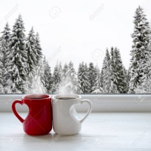 66630930-two-cups-of-coffee-on-a-windowsill-in-the-background-a-beautiful-winter-forest-in-snow.jpg