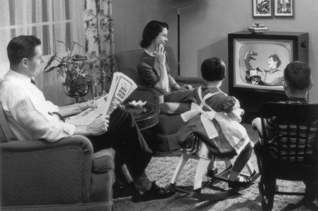 A-family-sits-in-their-living-room-watching-a-childrens-television-programme.jpg