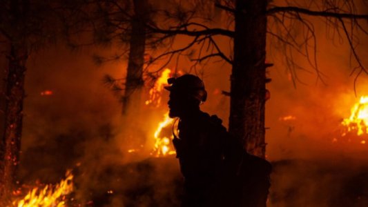 f18b7d89-852b-4112-95ef-4a208e7fe94f-large16x9_Afirefighterduringnighttimefirefightingoperatio...jpg
