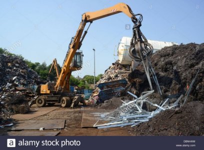 crane-sorting-through-scrap-metal-at-scrapyard-united-kingdom-DBNHAW.jpg