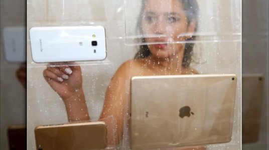 CellPhoneTabletHoldingShowerCurtains.jpg