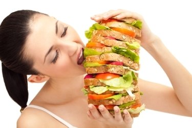 915-woman-eating-huge-sandwich.jpg