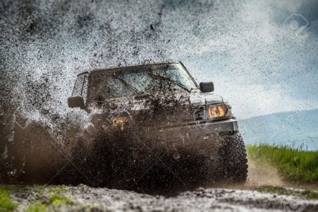 28368762-jeep-in-mud-and-dirt-splash.jpg