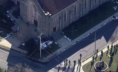 52807695-10391609-A_downed_helicopter_is_pictured_near_the_steps_of_the_Drexel_Hil-m-9_1641930...jpg