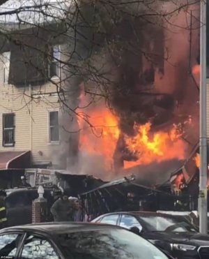 53078447-10415203-A_two_alarm_fire_broke_out_in_a_residential_three_story_building-a-38_164252...jpg