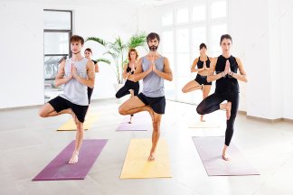 Yoga class doing tree pose.jpg