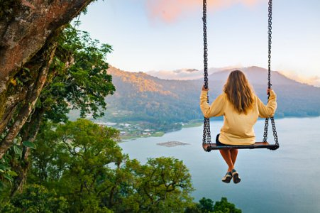 young-woman-looking-at-amazing-tropical-lake-in-mountains-picture-id1304888646.jpg