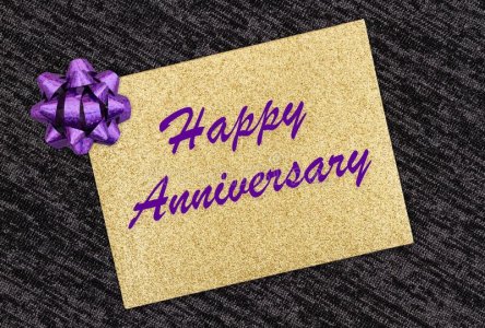 happy-anniversary-greeting-gold-glitter-card-purple-bow-black-216868082.jpg