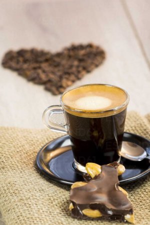 homemade-dark-chocolate-with-whole-nuts-cup-of-espresso-and-coffee-beans-JUNF000115.jpg