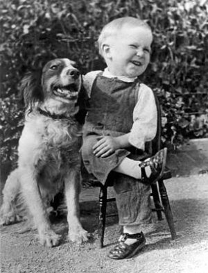 a-boy-laughs-with-his-dog-underwood-archives.jpg