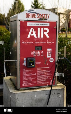 monroe-wa-usa-december-14-2021-air-compressor-at-gas-station-the-red-and-white-machine-has-the...jpg