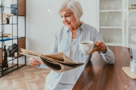 172649862-senior-woman-relaxing-at-home-reading-newspaper-and-having-breakfast.jpg