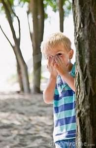 boy-hiding-behind-tree-7422965.jpg