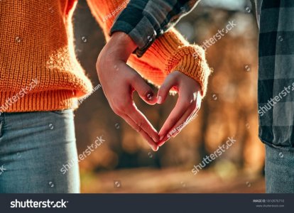 stock-photo-cropped-image-of-young-couple-walking-in-park-in-autumn-time-1810976710.jpg