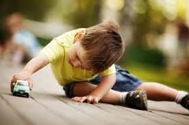 kid with toy car.jpg