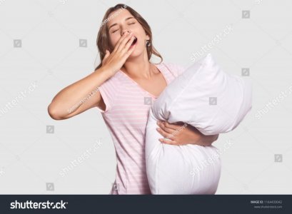 stock-photo-isolated-shot-of-sleepy-woman-with-widely-opened-mouth-yawns-as-hasnt-enough-sleep...jpg