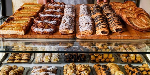 man-dispensing-cakes-in-a-pastry-bakery-royalty-free-image-1676319170-4101683622.jpg