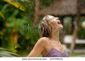 stock-photo-profile-of-a-young-attractive-woman-under-tropical-rain-with-her-mouth-open-10576993.jpg