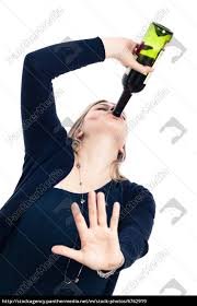Drunk woman drinking wine and gesturing ...