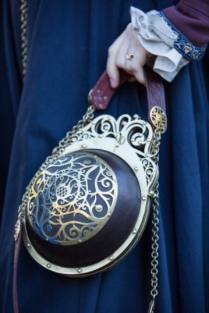 renaissance-memories-spherical-leather-bag-with-adjustable-straps-and-brass-accents.jpg