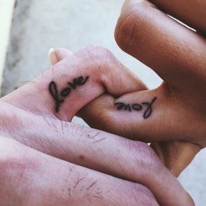his-and-hers-matching-love-word-finger-tattoos.jpg his-and-hers-matching-love-word-finger-tattoos.jpg