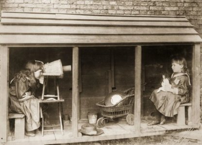 A little girl uses a stool and a flowerpot as a camera to photograph her friend, 1887.jpg