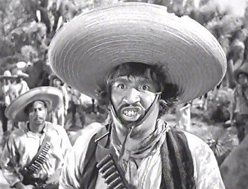 Alfonso-Bedoya-as-Gold-Hat-the-Mexican-bandit-who-roams-the-hills-the-men-are-mining-in-The-Tr...jpg
