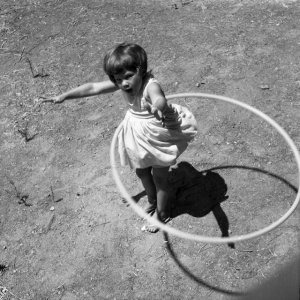 Girl_twirling_Hula_Hoop,_1958.jpg