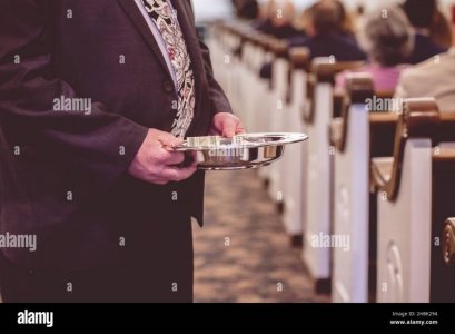 man-passing-the-offering-plate-in-a-traditional-american-church-2H8K294.jpg man-passing-the-offering-plate-in-a-traditional-american-church-2H8K294.jpg