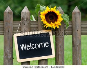 stock-photo-welcome-chalkboard-with-sunflower-148346903.jpg