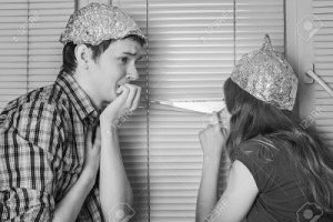 83480737-teen-couple-steam-boy-and-girl-protecting-the-brain-with-hats-made-of-aluminum-foil-f...jpg
