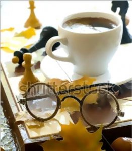 stock-photo-glasses-and-cup-of-coffee-on-chess-board-with-chessmen-on-a-wet-table-62708377.jpg