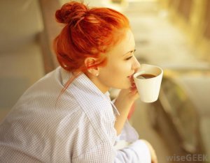 red-haired-woman-with-white-coffee-cup.jpg