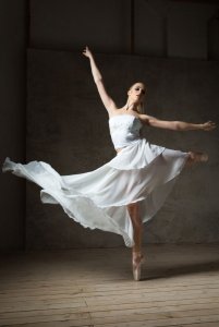 photodune-17229838-beautiful-ballet-dancer-in-white-costume-with-waving-skirt-dancing-m.jpg