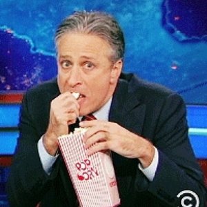 Jon-Stewart-Eagerly-Watching-Eating-His-Popcorn-On-The-Daily-Show_408x408.jpg