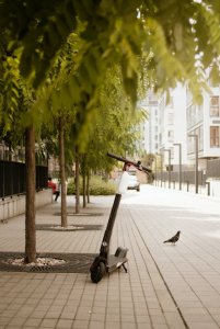 black-electric-scooter-parked-on-sidewalk-2727413 (1).jpg