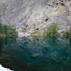 This water is so clear you can see to the bottom of this tiny "lake" in the mountains.  If you look carefully at the rock in the background,