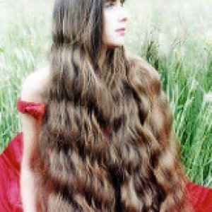 a beautiful brunette with waves in nature SM