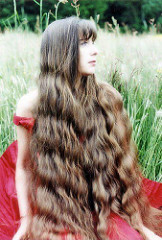 a beautiful brunette with waves in nature SM