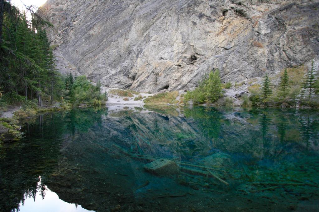 This water is so clear you can see to the bottom of this tiny &quot;lake&quot; in the mountains.  If you look carefully at the rock in the background,
